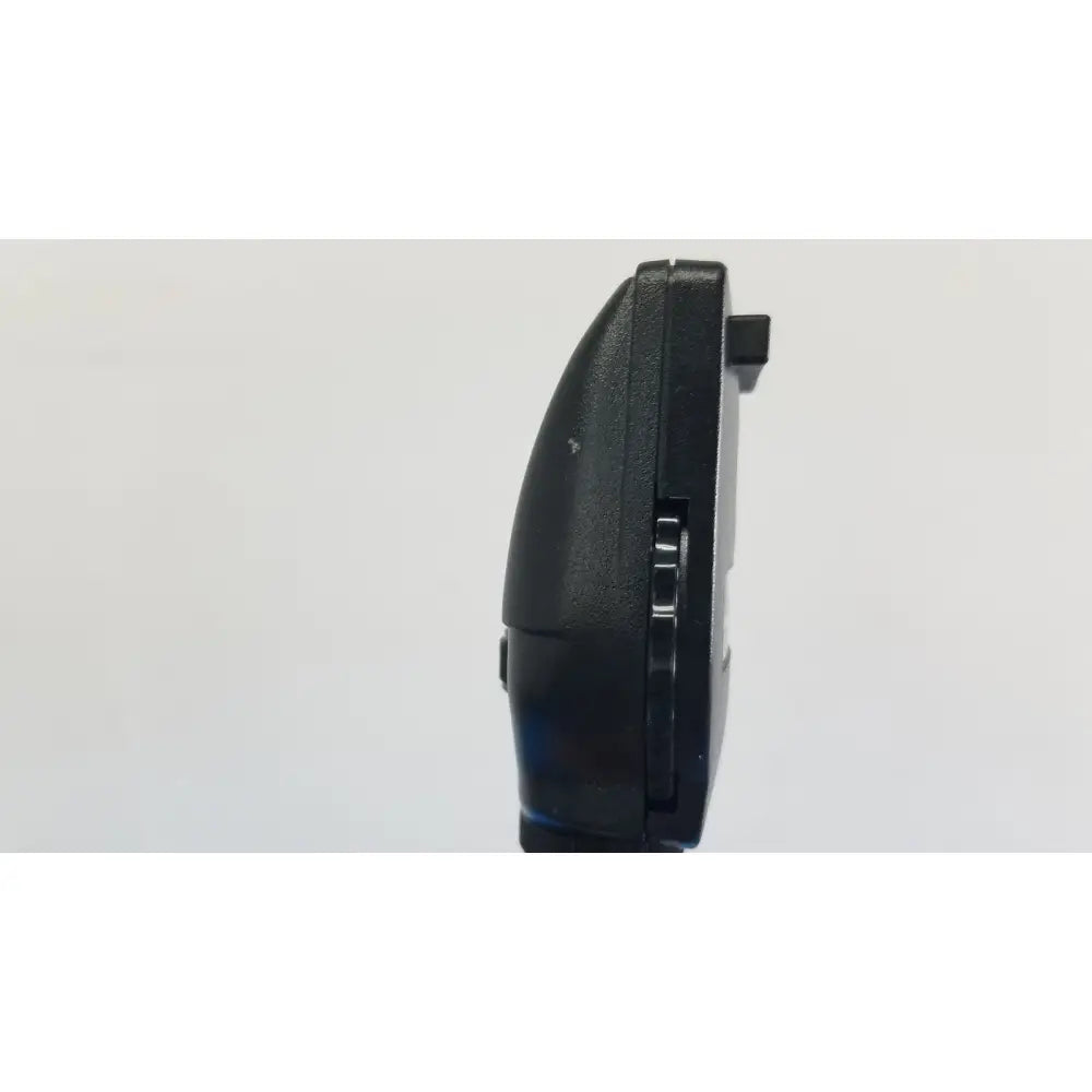 Black plastic nintendo ds handheld gaming console with matte finish and hinge mechanism beside welch allyn wall transformer reuse medical device