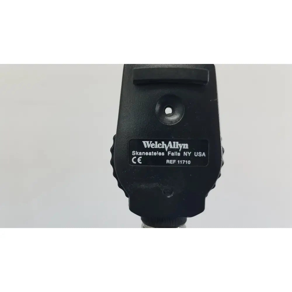 Black welch allyn ophthalmoscope with matte finish and textured grip included in wall transformer for reuse medical use