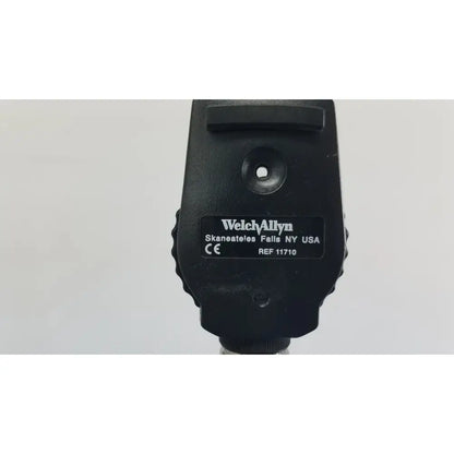 Black welch allyn ophthalmoscope with matte finish and textured grip included in wall transformer for reuse medical use