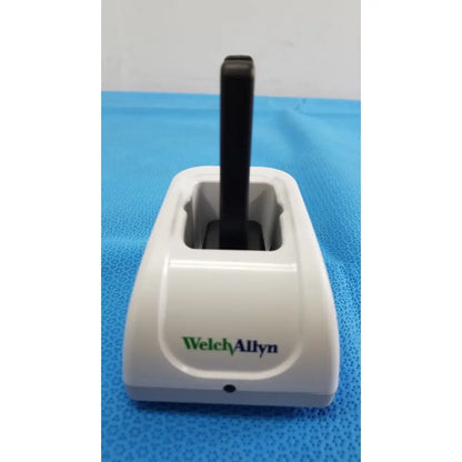 White plastic welch allyn kleenspec cordless led medical device with black cylindrical component for cordless led illumination