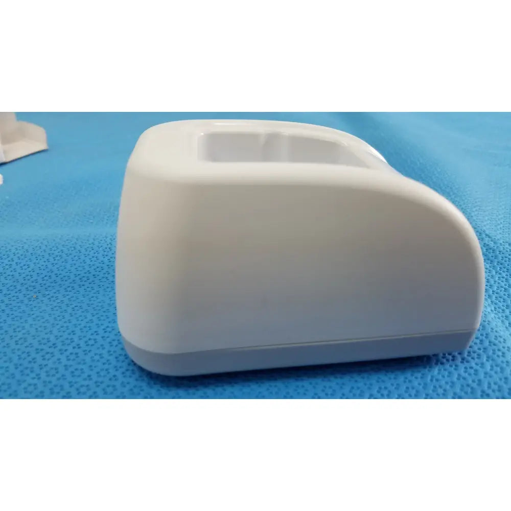 White plastic charger dock with rounded design and raised port for welch allyn kleenspec cordless led illumination system