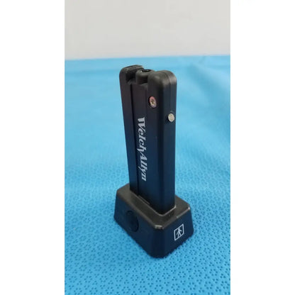 Black welch allyn kleenspec cordless led watch charger with sleek rectangular design and silver accent screws