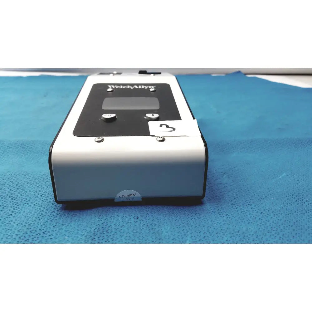 White and black welch allyn ad908b si plus calibration tester with digital display and two circular buttons used for plus calibration