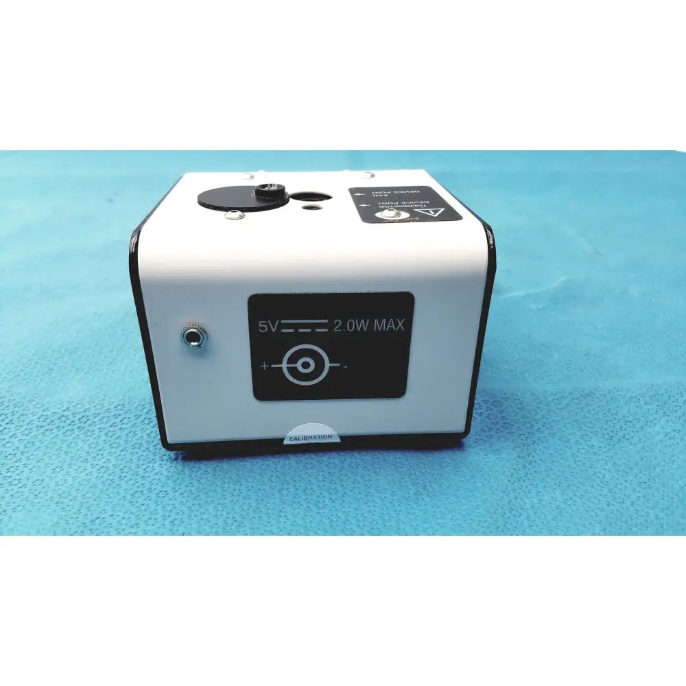 White rectangular welch allyn 9600 plus calibration tester laser pointer with black accents and 5v 2.0w max label