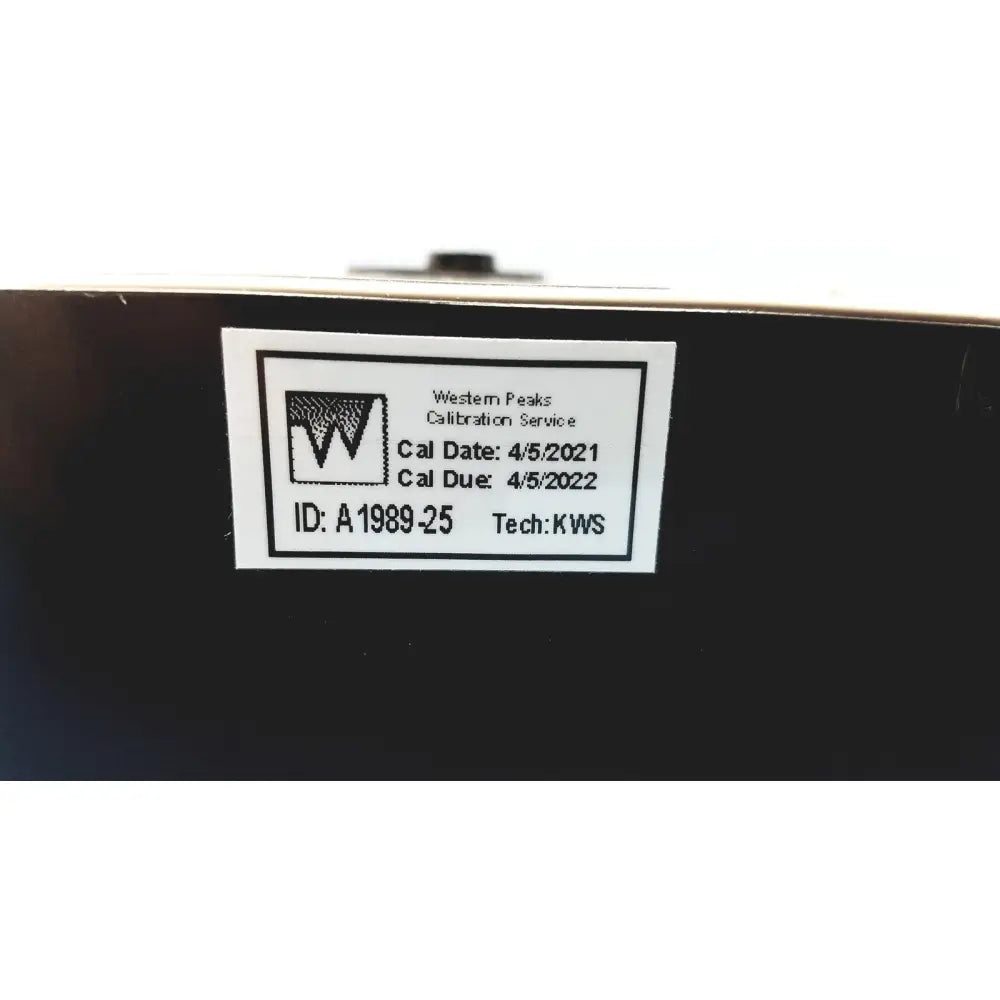 Black calibration label with white text and western peaks logo on the back of welch allyn 9600 plus calibration tester