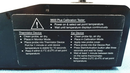 Black plastic welch allyn 9600 plus calibration tester with white printed instructions and warning label visible