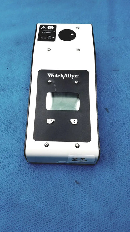 White and black Welch Allyn 9600 Plus calibration tester with digital display, two buttons, and circular lens on top