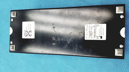 Black rectangular welch allyn 9600 plus calibration tester with textured surface and silver corner protectors