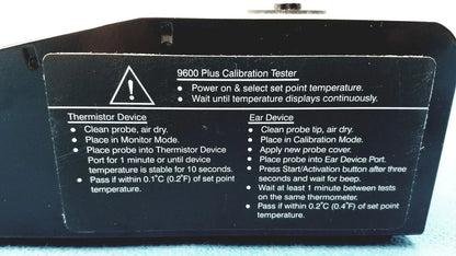 Black plastic welch allyn 9600 plus calibration tester with white printed instructions and warning label visible