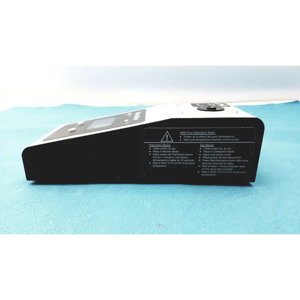 Black welch allyn 9600 plus calibration tester with digital display and control buttons on top surface for precise use