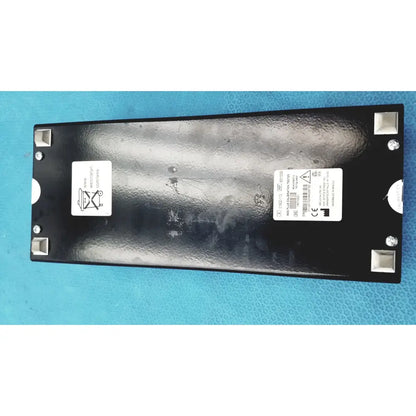 Black rectangular welch allyn 9600 plus calibration tester with textured surface and silver corner protectors