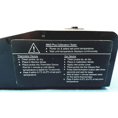 Black plastic welch allyn 9600 plus calibration tester with white printed instructions and warning label visible