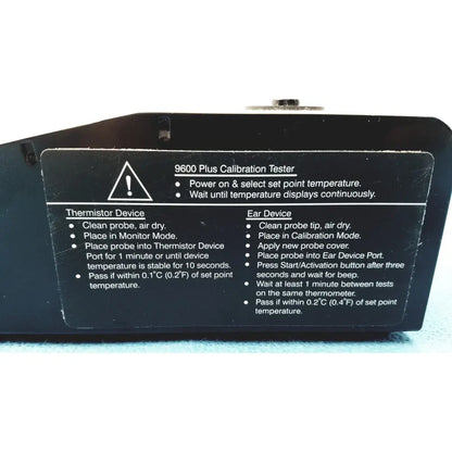 Black plastic welch allyn 9600 plus calibration tester with white printed instructions and warning label visible