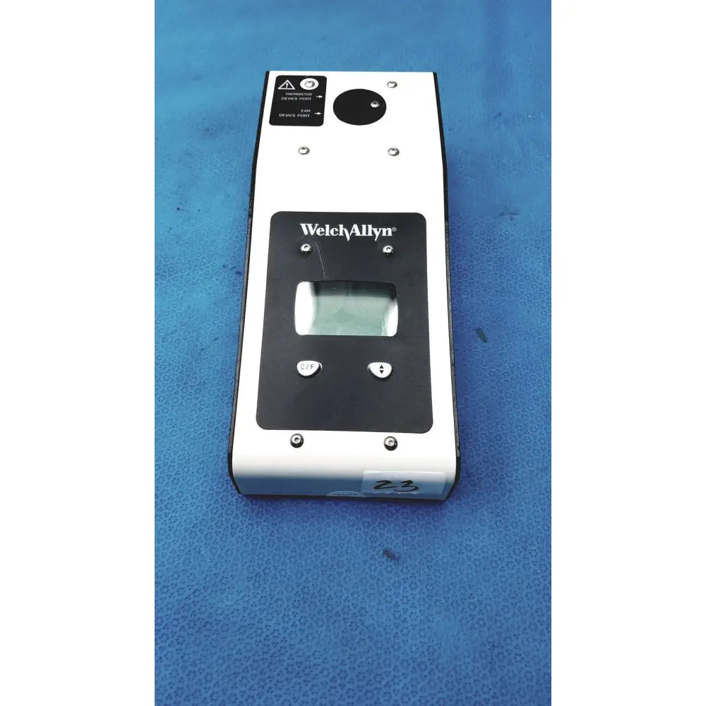 White and black Welch Allyn 9600 Plus calibration tester with digital display, two buttons, and circular lens on top