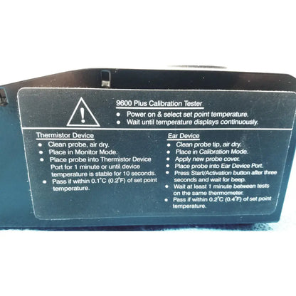 Black Welch Allyn 9600 plus calibration tester with white instructional text and warning triangle for precise plus calibration