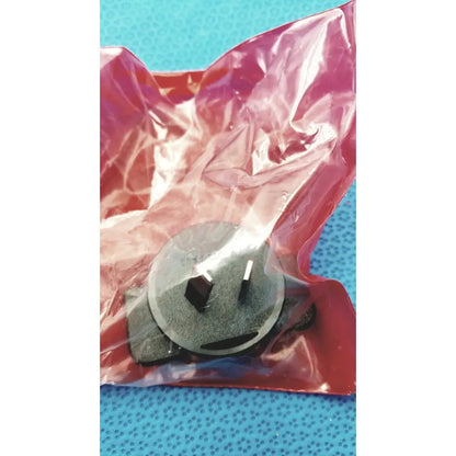 Black plastic australian-style power plug with two flat pins and grounding clip in red sealed packaging for welch allyn plus calibration tester