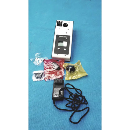 Silver and black welch allyn 9600 plus calibration tester with digital display, control buttons, and warning labels
