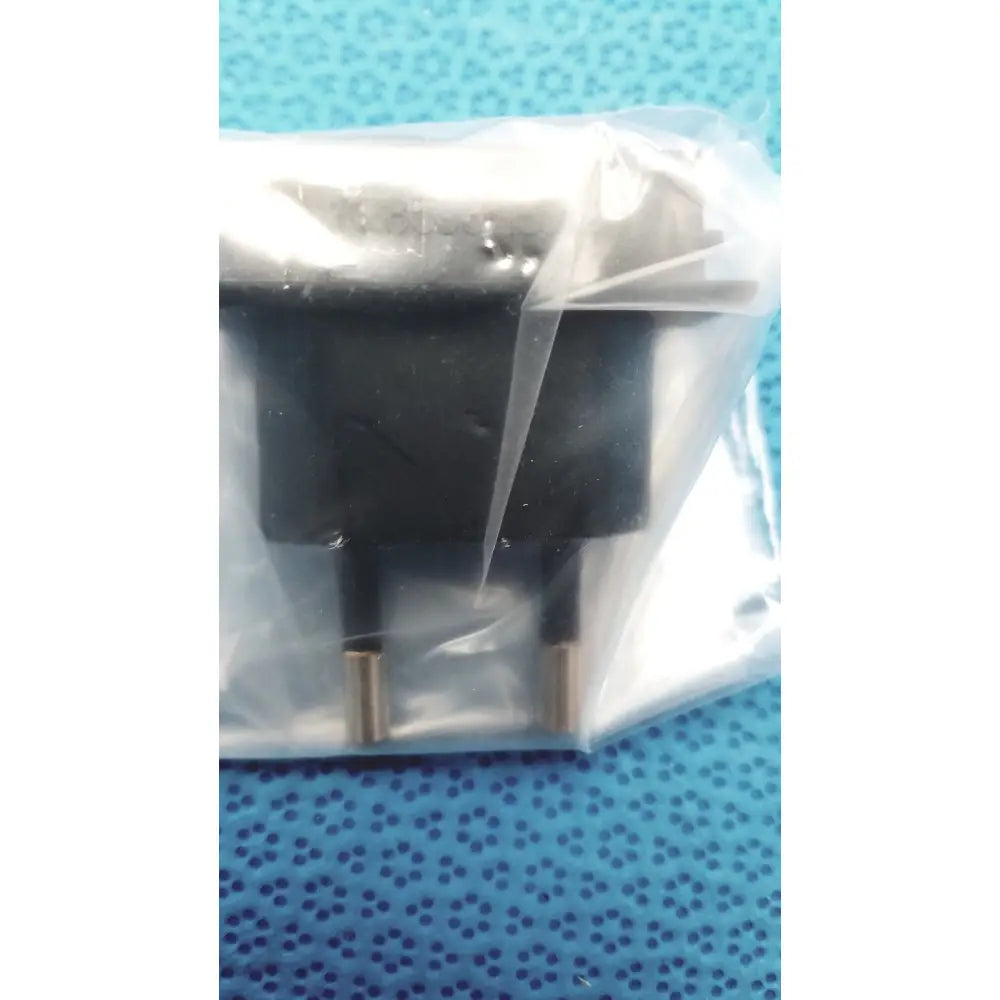 Black plastic eu-style power adapter with gold metal prongs sealed in bag for welch allyn 9600 plus calibration tester