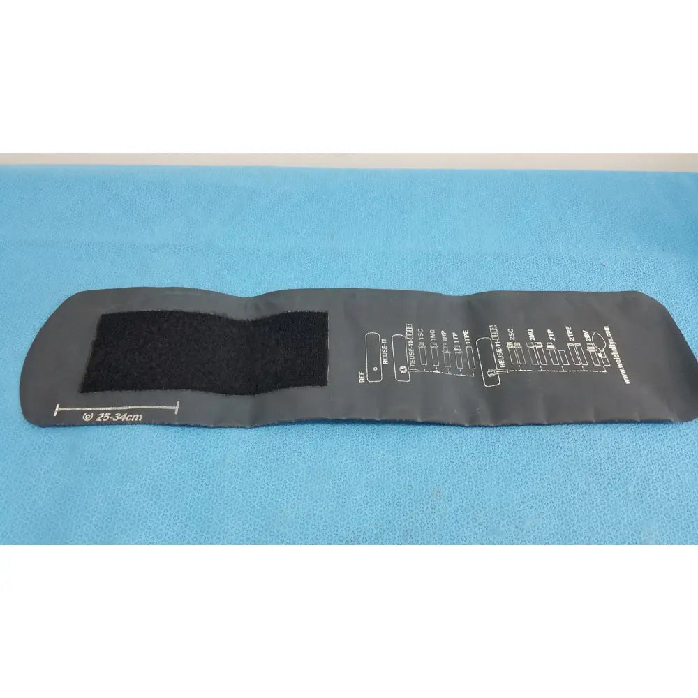 Black inflatable welch allyn adult 11 blood pressure cuff with velcro strap and measurement chart on side