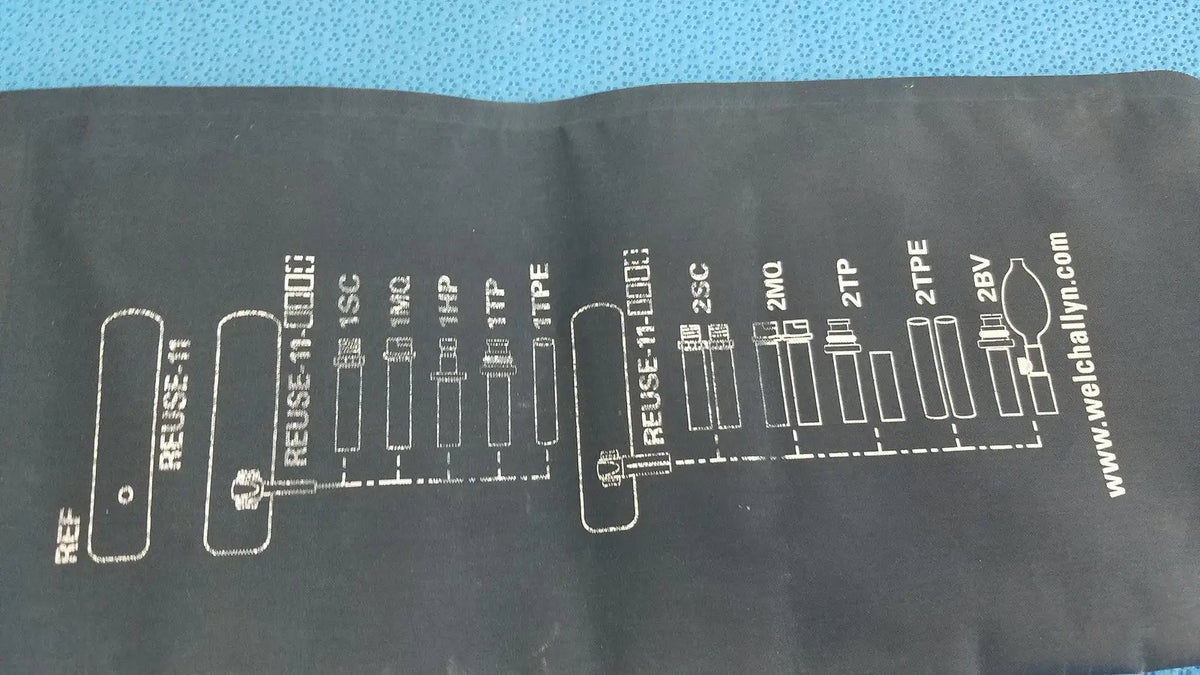 Black fabric sleeve of welch allyn adult 11 blood pressure cuff with white diagram of medical tubing connections and website address