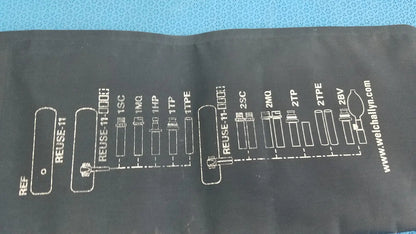 Black fabric sleeve of welch allyn adult 11 blood pressure cuff with white diagram of medical tubing connections and website address
