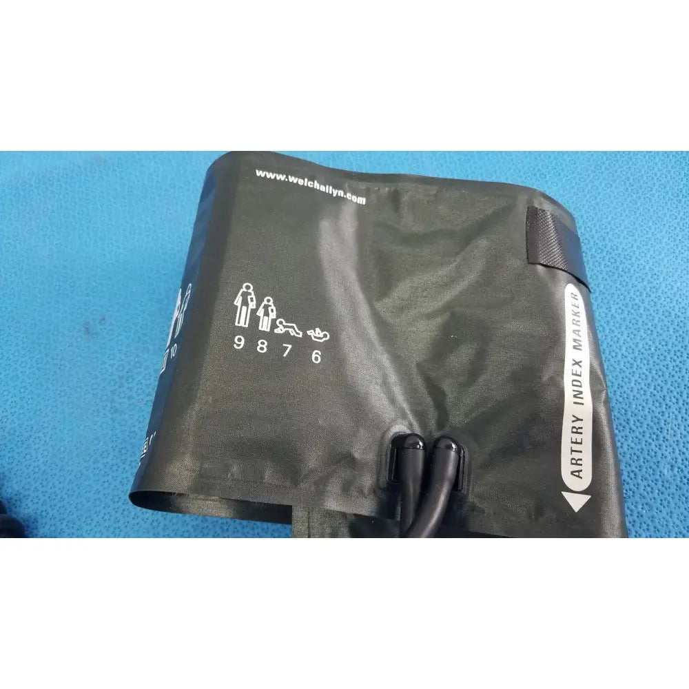 Black welch allyn adult blood pressure cuff with white sizing indicators and artery index marker for accurate measurement