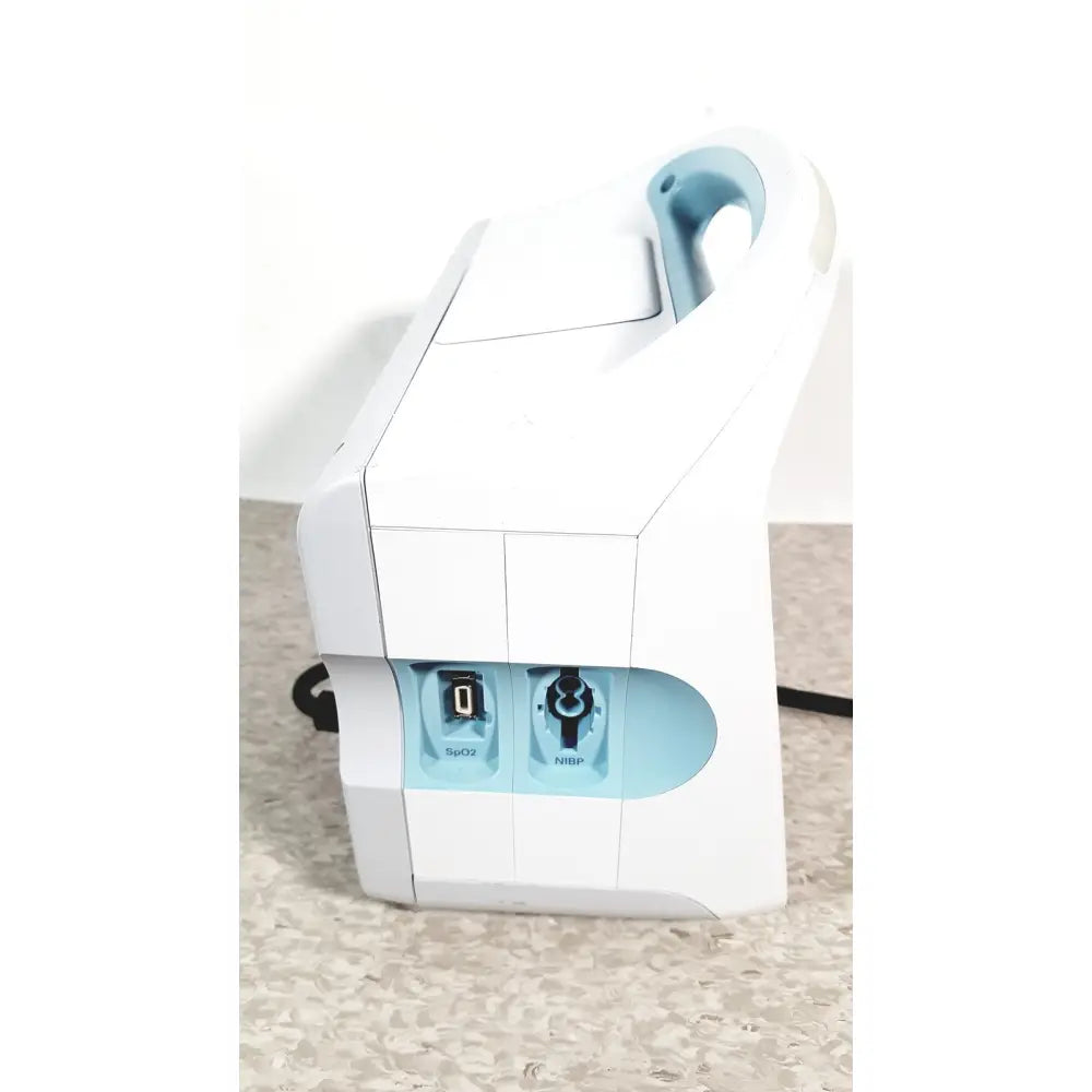 White and light blue welch allyn connex 6000 series vital signs monitor with handle and labeled spo2 nibp ports