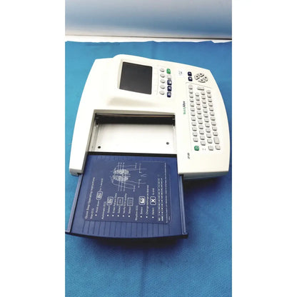 White welch allyn cp 200 ekg ecg monitor with blue paper tray showing anatomical diagrams and operational instructions