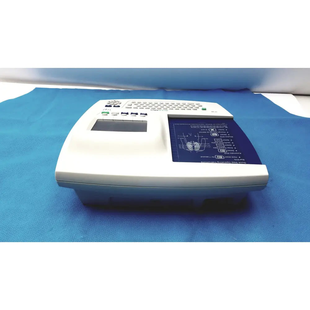 White welch allyn cp 200 ekg ecg monitor with built-in keyboard and blue display screen showing diagrams