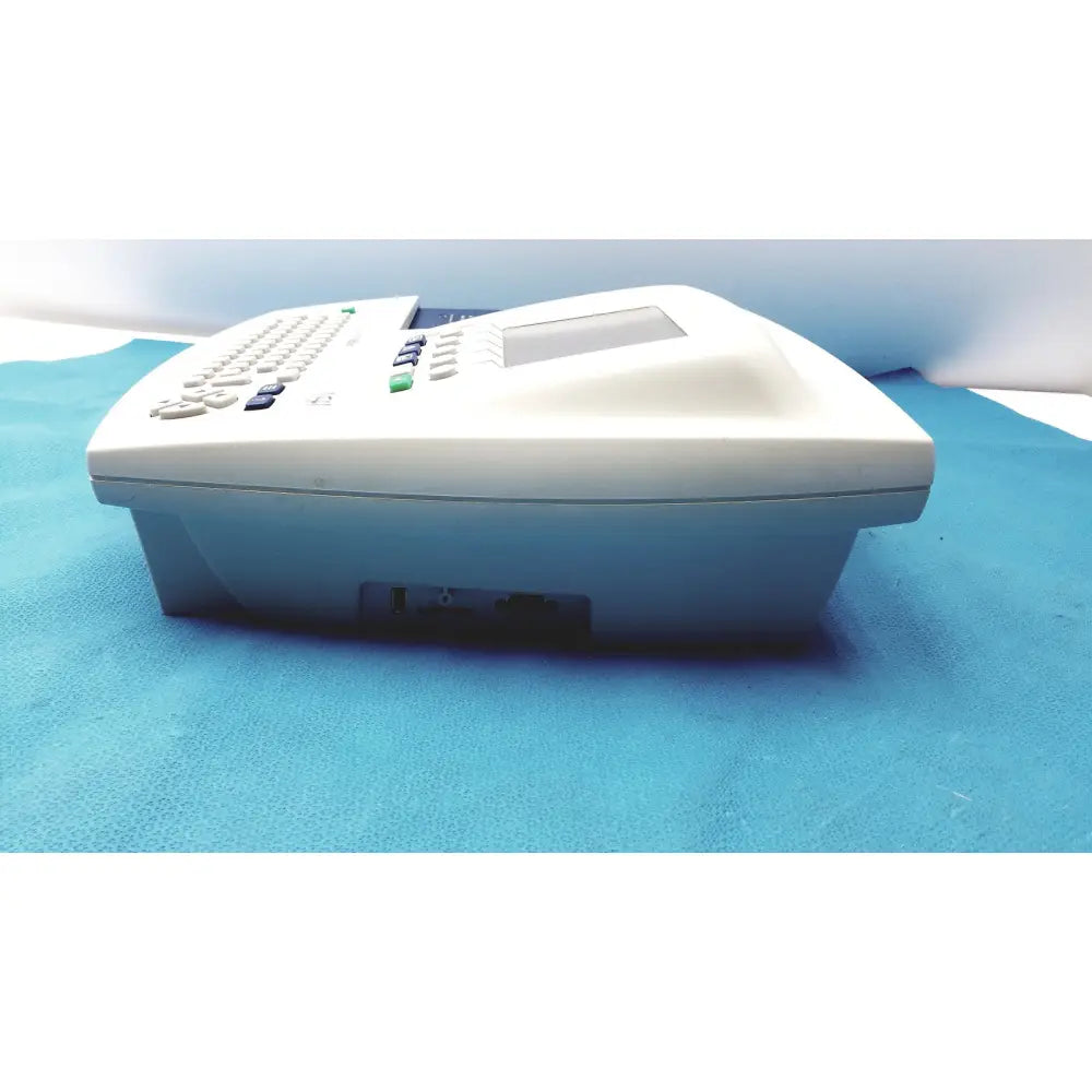 White plastic office phone with small screen and keypad in welch allyn cp 200 ekg ecg monitor device