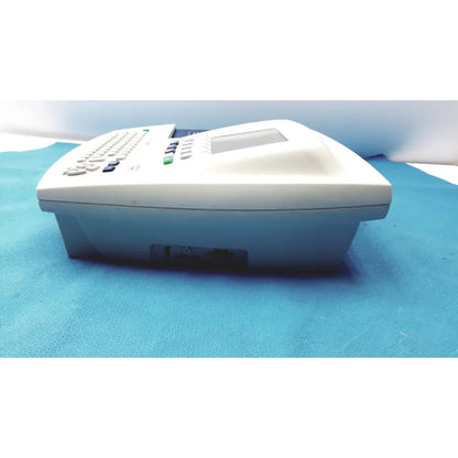 White plastic office phone with small screen and keypad in welch allyn cp 200 ekg ecg monitor device