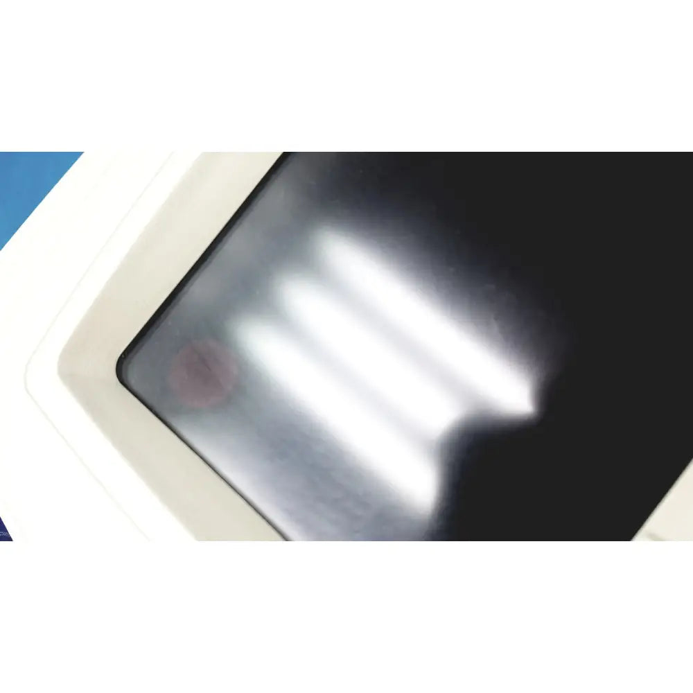 White-framed welch allyn cp 200 ekg ecg monitor displaying blurred vertical light streaks on digital screen