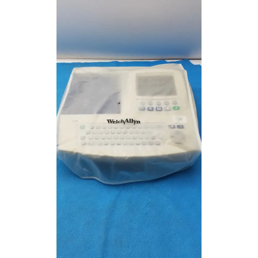 White welch allyn cp 200 ekg ecg monitor wrapped in clear plastic for durable medical use