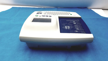 White welch allyn cp 200 ekg ecg monitor with built-in keyboard and blue display screen showing diagrams