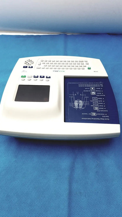 White welch allyn cp 200 ekg ecg monitor with built-in keyboard touchpad and illuminated blue diagnostic display screen
