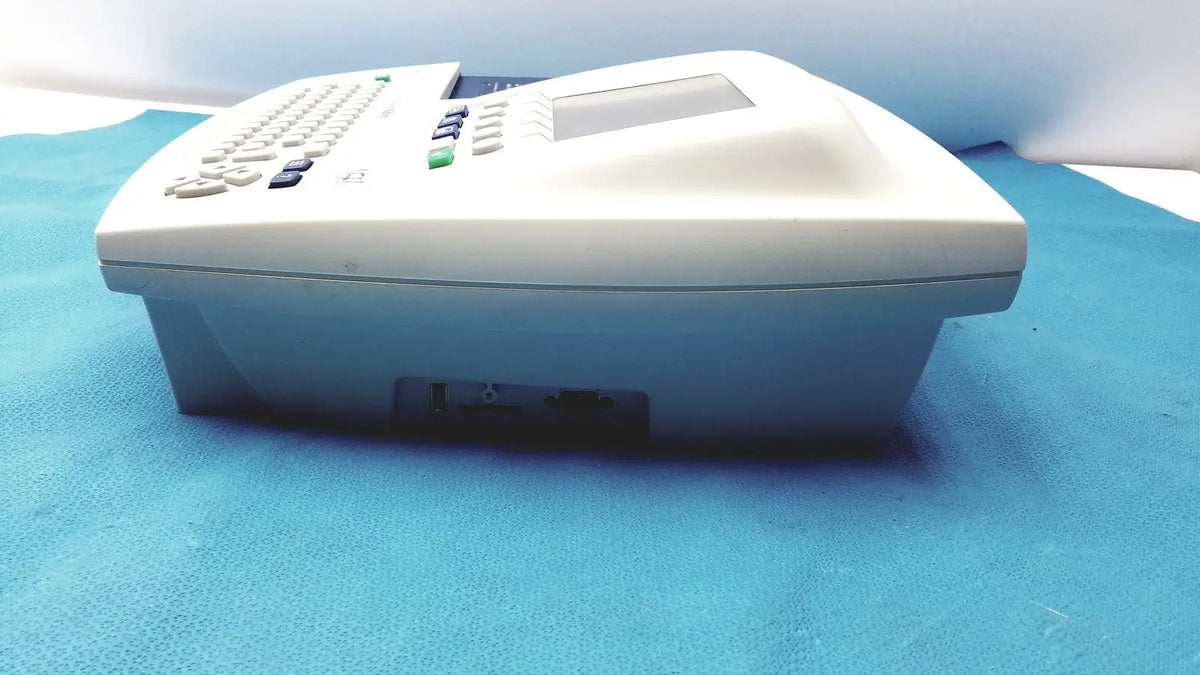White plastic office phone with small screen and keypad in welch allyn cp 200 ekg ecg monitor device