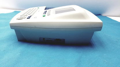 White plastic office phone with small screen and keypad in welch allyn cp 200 ekg ecg monitor device