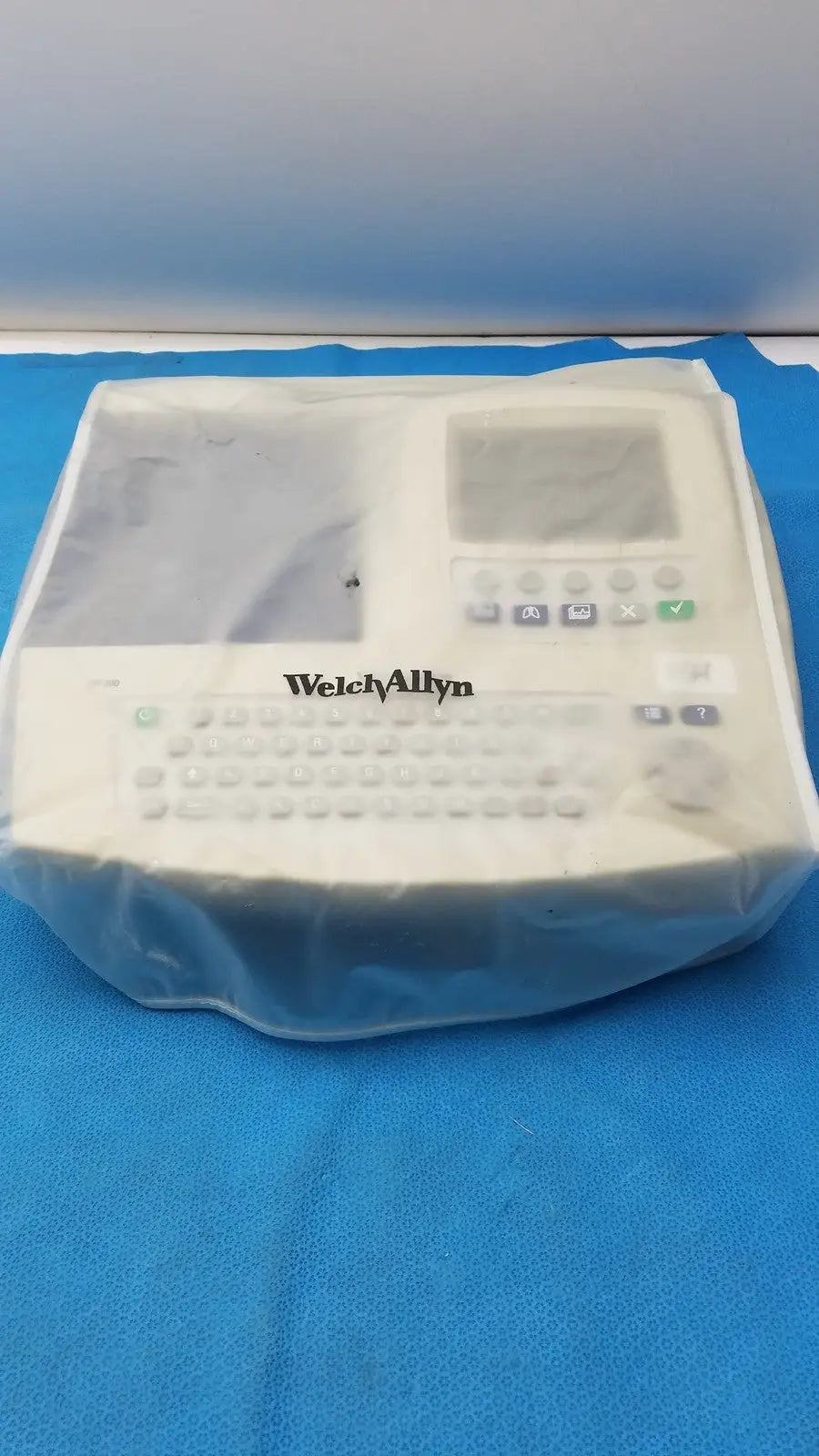 White welch allyn cp 200 ekg ecg monitor wrapped in clear plastic for durable medical use