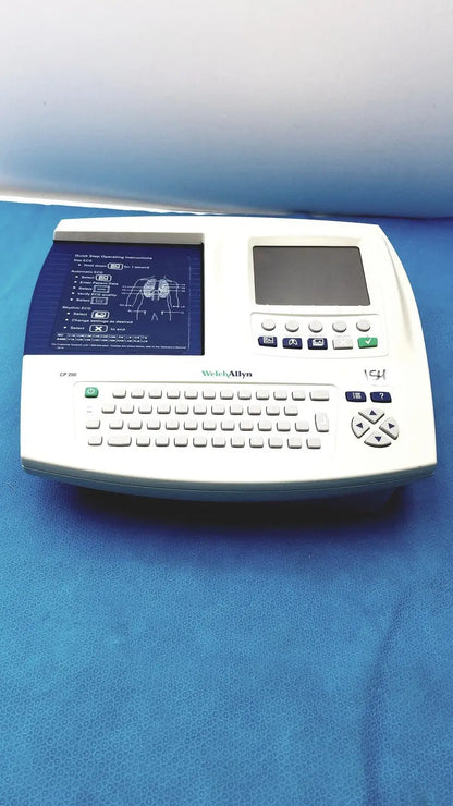 White welch allyn cp 200 ekg ecg monitor with built-in keyboard, small screen, and printed ecg display panel