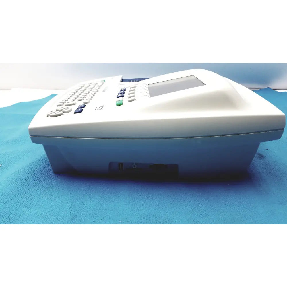 White plastic office phone with small screen and keypad for welch allyn cp200 ekg monitor use