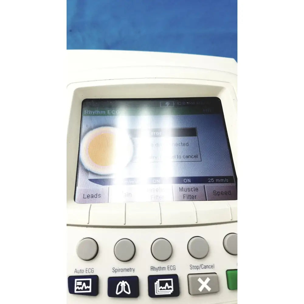 White welch allyn cp200 ekg monitor with touchscreen displaying rhythm ecg and physical buttons for spirometry and auto ecg