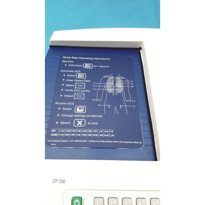White welch allyn cp200 ekg ecg monitor with blue panel showing step-by-step instructions for stat automatic and rhythm ecg functions