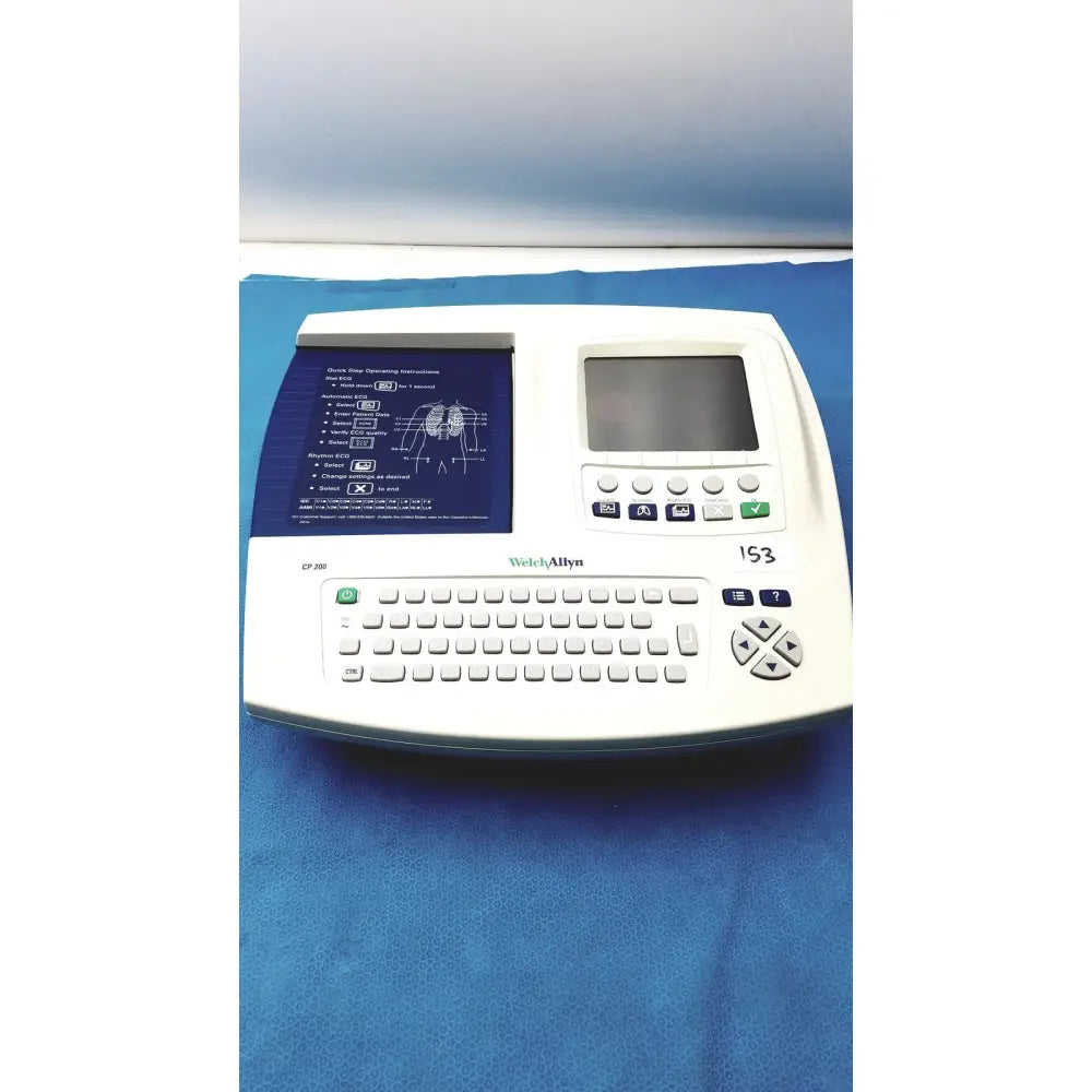 White Welch Allyn CP200 EKG ECG monitor with built-in keyboard, small screen, and blue instructional panel for cardiac use