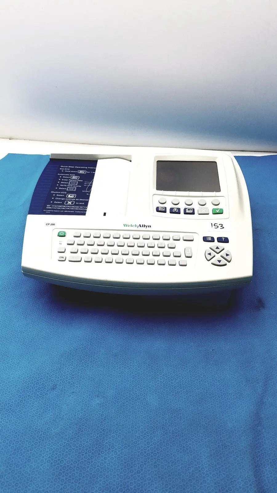 White welch allyn cp200 portable ecg monitor with small screen numeric keypad and paper output slot for cardiac use