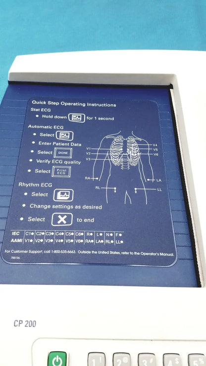 White welch allyn cp200 ekg ecg monitor with blue panel showing step-by-step instructions for stat automatic and rhythm ecg functions