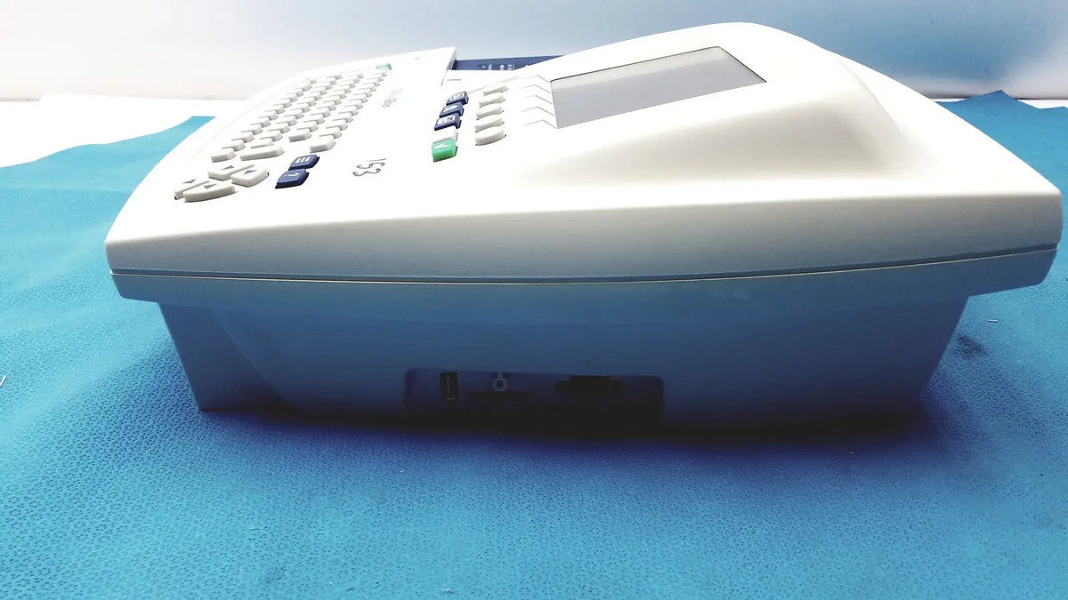 White plastic office phone with small screen and keypad for welch allyn cp200 ekg monitor use