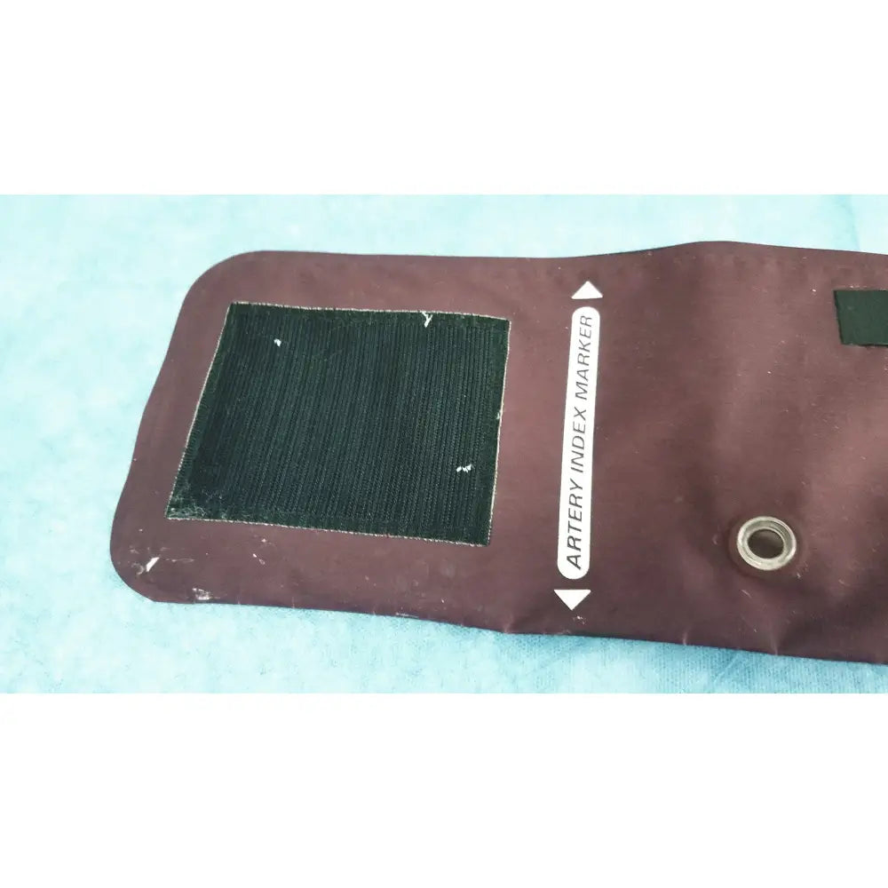 Welch Allyn maroon reusable blood pressure cuff with black velcro and artery index marker for large adult use