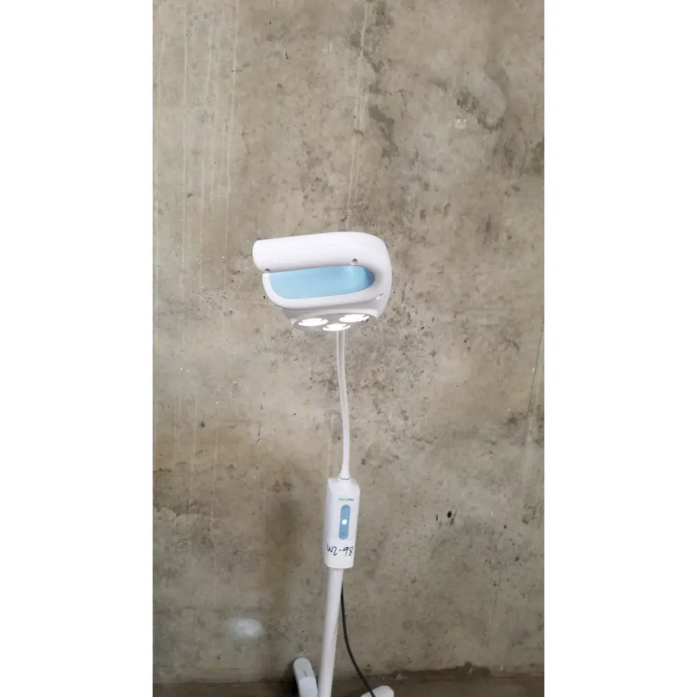 Welch Allyn GS 600 exam light white and light blue medical lamp with adjustable arm and rolling stand control panel