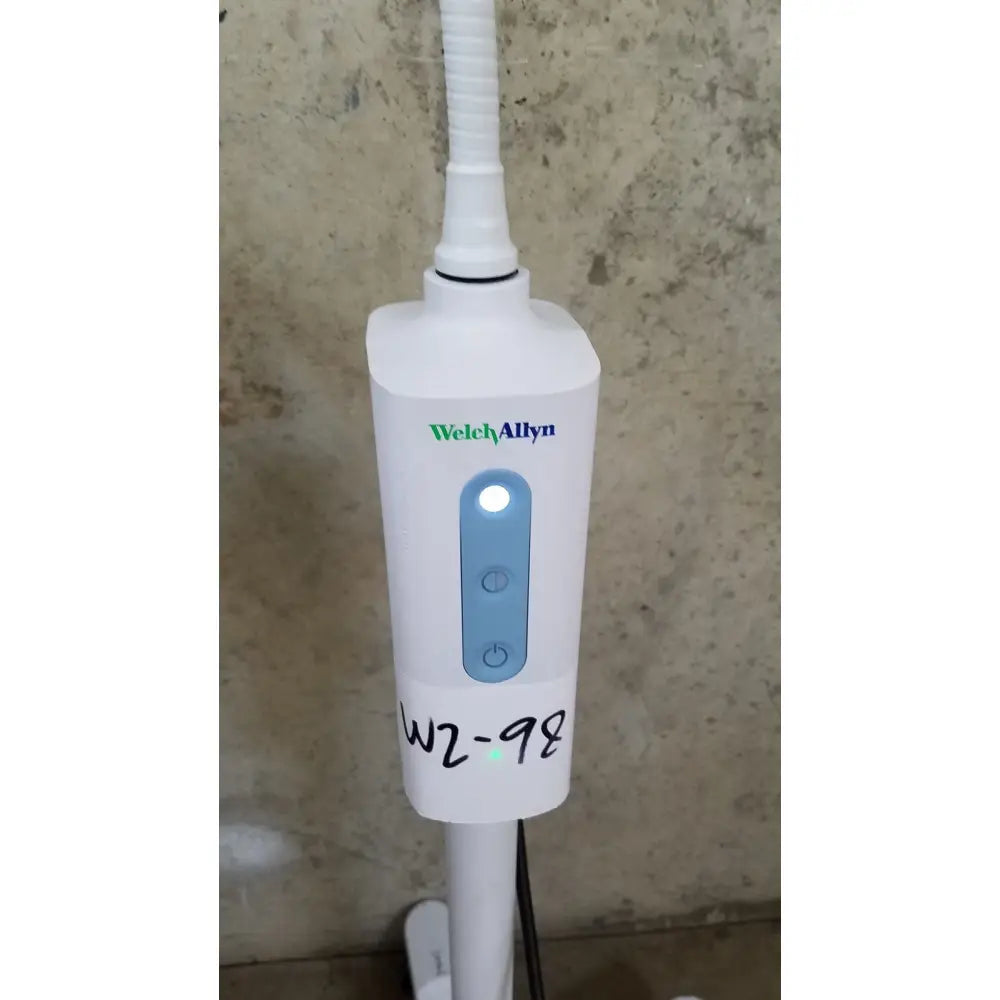 Welch allyn gs 600 exam light on rolling stand with blue illuminated button and two circular controls showing model w2-98