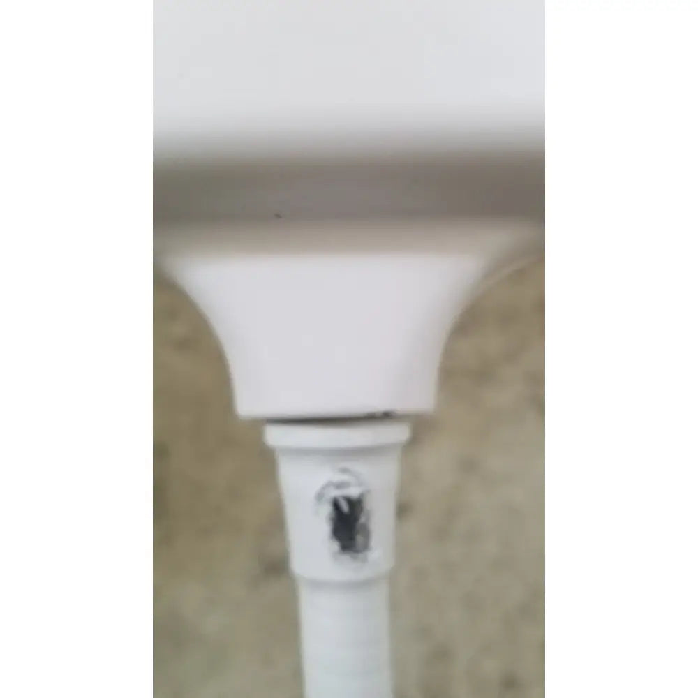 White plastic pipe with black circular mark on the side of welch allyn gs 600 exam light with rolling stand